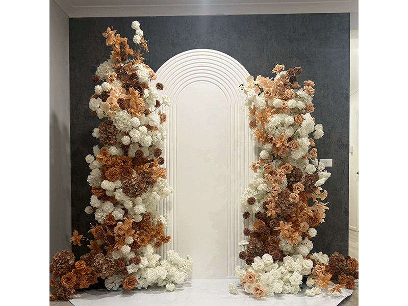 Rust and white faux pillar florals framing a white arch